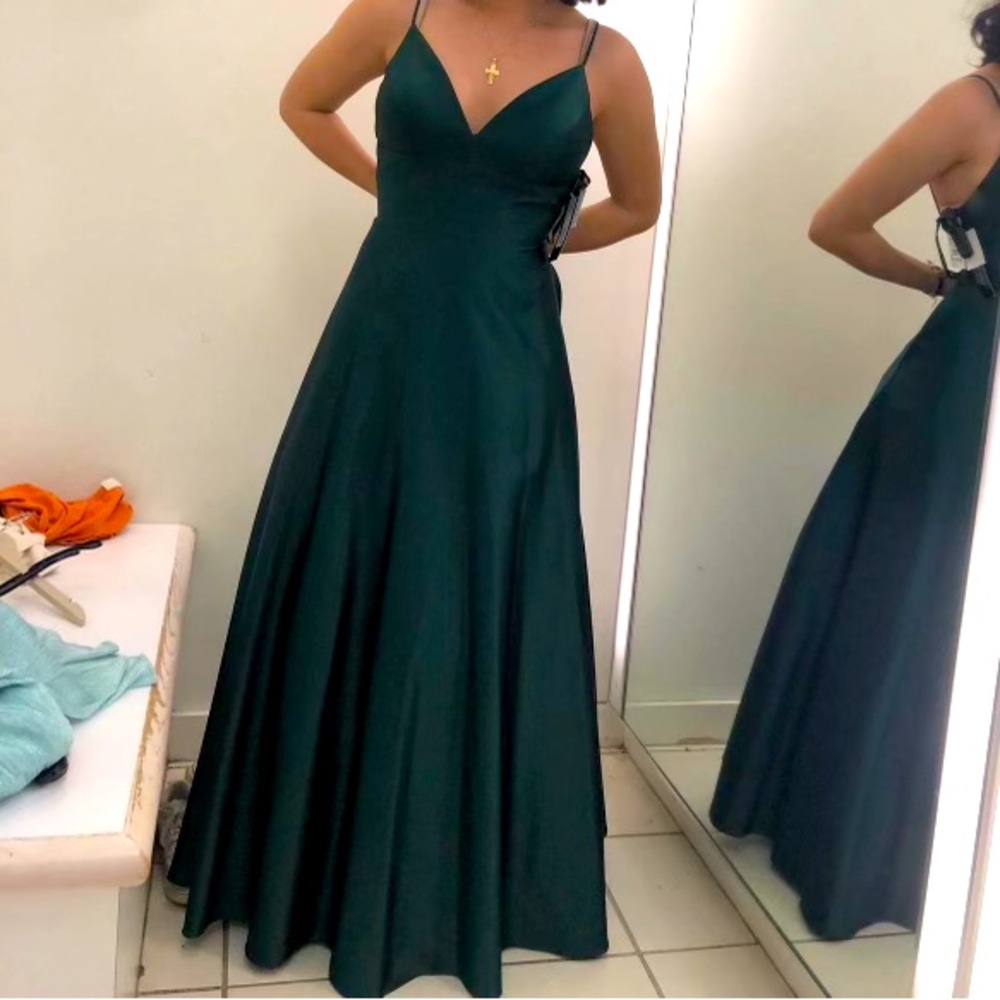 Beautiful prom dress, green color with side pockets and worn only one time .